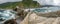 Stairs and dog in San juan de Gaztelugatxe wide panorama