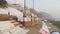 Stairs of Ganges river covered with sheets, with people passing.