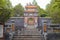 Stairs and gate leading to Tu Duc emperor tomb in Hue Vietnam