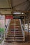 Stairs leading to overpass crossing tracks at a Chicago el station located at Adams/Wabash.
