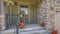 Stairs leading to porch with reflective glass door