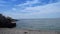 Stairs leading to the sea, beach umbrellas and pedal boats in the background,two shots