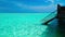 Stairs leading to tropical lagoon on tropical Maldives island with tourquise clear water