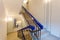 Stairs with mirror in the wall is the part of interior of apartment after remodeling, renovation, extension, restoration