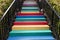 Stairs painted in rainbow colors background