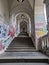 Stairs and passageways adorned with vibrant graffiti, adding an urban and artistic touch to the city\\\'s landscape