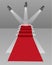 Stairs with red carpet and three lights