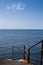 Stairs, rusted railing and Mediterranean sea