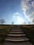 Stairs stretching into the blue sky