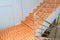 Stairs tile orange walkway down. select focus with shallow depth of field