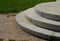 Stairs to the villa or to the church. formal staircase with three steps to the arch. Circular granite attached to a garden path ma