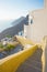Stairs to yellow Santorini terrace, Greece