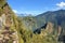 Stairs of trail with Machu Picchu far below in the