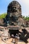 Stairs under stone head encarving Bayon temple