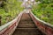 Stairway going up to the buddhist temple in jungle forest