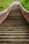 Stairway going up to the buddhist temple in jungle forest