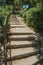 Stairway with iron handrail going towards a garden in Madrid