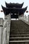 The stairway of the Nanhua Bridge arches over the Tuo Jiang River in Fenghuang Ancient City in Tibet, China