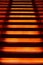 Stairway with orange and yellow lights along steps creating a vector illustration