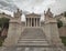 Stairway between Plato and Socrates statues in front of the national academy of Athens, Greece under an impressive cloudy sky
