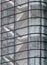 Stairways between the floors of a futuristic modern commercial building behind a curved glass facade