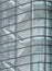 Stairways between the floors of a futuristic modern commercial building behind a curved glass facade