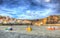 Staithes North Yorkshire England uk with boats in harbour in colourful hdr