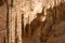 Stalactite and Stalagmite formations into the Frasassi Caves Grotte di Frasassi, Marche, Ancona, Italy