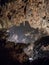 Stalactites forming a tunnel in Valporquero`s cave Spain