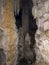 stalactites, stalagmites and large calcareous pillars inside the cave formed over millions of years