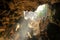 Stalagmite ,stalactite, limestone and tunnel in cave with hole beam sunlight