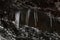 Stalagmites and stalactites inside the underground glacier in Scarisoara glacier cave.