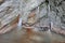 Stalagmites and stalactites inside the underground glacier in Scarisoara glacier cave.