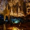 Stalagtite cave with multiple colors and holes in the rock