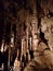 Stalagtites stalagmites and columns in underground cavern