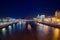 Stalin Skyscraper on Kotelnicheskaya Embankment of the Moscow River. Night shot of Moscow river reflection.