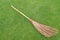 Stalk coconut broom isolated on the lawn