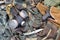 Stalker soldiers soviet gas mask lies with handgun and knife on green khaki camouflage jackets