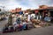 Stalls selling various goods including hats and baskets in the Marrakesh medina in Morocco.