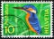 Stamp 10 Swiss centimes printed by Swiss Confederation, shows animal bird Common Kingfisher Alcedo