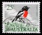 Stamp printed in Australia shows Eastern Scarlet Robin Petroica boodang - a common red-breasted Australasian robin