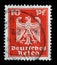 Stamp printed in the German Empire shows coat of arms of Germany