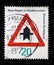 Stamp printed in Germany dedicated to New traffic rules, shows a road sign `Proceed with caution`