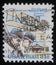 Stamp printed in USA showing Wright brothers and Wright Flyer I plane