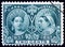 Stamp showing portraits of young and old Queen Victoria