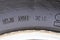 stamping on a tire where date and year of issue are indicated. Close-up. Old wheel, replacement required