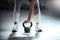 Stance of power. Cropped shot of an unrecognizable woman lifting a kettlebell at the gym.