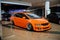 Stanced orange Honda Odyssey on car show