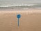 Stand for a lifebuoy on the deserted beach. Coast of the Baltic Sea