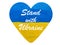 Stand with Ukraine message on heart with Ukrainian flag